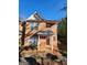 Charming brick townhome exterior featuring a covered porch and large windows for natural light at 3874 Austin Park Ne Ln, Decatur, GA 30032