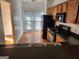 Well-lit kitchen features wood cabinets, black appliances, and view of the eat-in area at 3874 Austin Park Ne Ln, Decatur, GA 30032