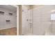 Modern bathroom featuring a glass shower and an adjacent closet, offering a blend of style and functionality at 745 Myrica Ave, Locust Grove, GA 30248