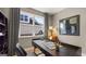 Stylish office with modern desk, shelving, chair and window with natural light at 745 Myrica Ave, Locust Grove, GA 30248