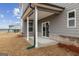 Inviting backyard patio with white columns, offering an outdoor living space at 275 Arwen Dr # 68, Mcdonough, GA 30252
