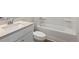 Clean bathroom featuring a toilet, bathtub, and sink with modern fixtures at 275 Arwen Dr # 68, Mcdonough, GA 30252
