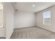 Spacious bedroom featuring carpet, natural light from the windows, and light walls at 275 Arwen Dr # 68, Mcdonough, GA 30252