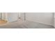 Bright bedroom with gray carpet, base trim, and white walls at 275 Arwen Dr # 68, Mcdonough, GA 30252