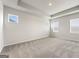 Spacious bedroom featuring carpet, natural light from the windows, and light walls at 275 Arwen Dr # 68, Mcdonough, GA 30252