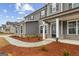 A charming gray two-story home with manicured front yard and welcoming entrance at 275 Arwen Dr # 68, Mcdonough, GA 30252