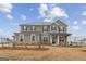 Charming two-story home with gray siding, black shutters, and landscaped front yard at 275 Arwen Dr # 68, Mcdonough, GA 30252