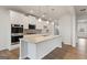 Bright kitchen features an island, granite countertops, stainless appliances, and ample cabinet space at 275 Arwen Dr # 68, Mcdonough, GA 30252