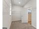 Spacious walk-in closet with ample shelving and carpet flooring for organization and comfort at 275 Arwen Dr # 68, Mcdonough, GA 30252