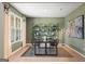 Stylish dining room featuring modern decor, hardwood floors, decorative shelving, and a large window at 275 Arwen Dr # 68, Mcdonough, GA 30252