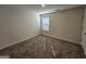 This bedroom features neutral walls, carpet, and a window with blinds at 1925 Labonte Pkwy, Mcdonough, GA 30253