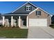 Beautiful new construction brick home with a two-car garage and inviting front porch at 741 Myrica Ave, Locust Grove, GA 30248