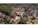 Drone view of the large home with private backyard pool, basketball court, circular drive and private lot at 1408 Hemphill Rd, Stockbridge, GA 30281