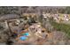 Drone view of the home and its surrounding properties, showcasing the backyard pool and basketball court at 1408 Hemphill Rd, Stockbridge, GA 30281