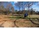 Spacious backyard with mature trees, hammock and plenty of room for outdoor activities at 1408 Hemphill Rd, Stockbridge, GA 30281