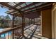 Beautiful balcony featuring a wood pergola with a peekaboo view of the inground pool at 1408 Hemphill Rd, Stockbridge, GA 30281