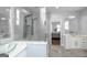 Spacious bathroom showcasing a glass-enclosed shower with dual shower-heads and a vanity with a vessel sink at 1408 Hemphill Rd, Stockbridge, GA 30281