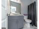 Stylish bathroom showcasing a vessel sink on a modern vanity, complemented by a coordinated shower curtain at 1408 Hemphill Rd, Stockbridge, GA 30281