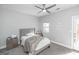 Neutral bedroom featuring a plush bed, soft carpet, and a view outside, creating a serene and calming atmosphere at 1408 Hemphill Rd, Stockbridge, GA 30281
