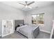 Cozy bedroom featuring a ceiling fan and a sunny window at 1408 Hemphill Rd, Stockbridge, GA 30281