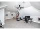 Open bonus room with desk, seating area and basketball game at 1408 Hemphill Rd, Stockbridge, GA 30281