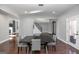 Elegant dining room featuring a sleek black table, stylish gray chairs, and a modern chandelier at 1408 Hemphill Rd, Stockbridge, GA 30281