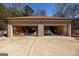 Spacious three-car garage with ample storage space and a variety of vehicles at 1408 Hemphill Rd, Stockbridge, GA 30281