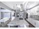 Spacious kitchen with a large island, stainless steel appliances, and custom white cabinetry at 1408 Hemphill Rd, Stockbridge, GA 30281
