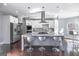 Modern kitchen with stainless steel appliances, marble countertops, and a center island with seating at 1408 Hemphill Rd, Stockbridge, GA 30281