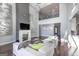 Modern living room with sleek fireplace, tall ceilings, and contemporary decor at 1408 Hemphill Rd, Stockbridge, GA 30281
