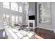 Spacious living room with large windows, modern fireplace, and contemporary decor at 1408 Hemphill Rd, Stockbridge, GA 30281