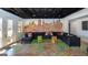 Basement living room features a unique graffiti city skyline and comfortable seating at 1408 Hemphill Rd, Stockbridge, GA 30281