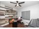 Comfortable office space featuring hardwood floors, a ceiling fan, and a unique custom wall design at 1408 Hemphill Rd, Stockbridge, GA 30281