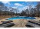 Beautiful backyard featuring a large inground pool with lounge chairs at 1408 Hemphill Rd, Stockbridge, GA 30281