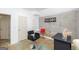 Cozy salon with concrete accent wall, black furnishings, and a modern minimalist design at 1408 Hemphill Rd, Stockbridge, GA 30281