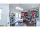 Large walk-in closet with custom shelving, ample storage for shoes, clothes and a fancy light fixture at 1408 Hemphill Rd, Stockbridge, GA 30281