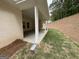 Covered outdoor patio and backyard of the property, showing drainage at 5311 Tuscany Dr # 98 Plapprox Sqft, Douglasville, GA 30135