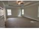 Large bedroom with plush carpet, recessed lighting, and two windows offering scenic outdoor views at 5311 Tuscany Dr # 98 Plapprox Sqft, Douglasville, GA 30135