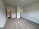 A spacious bedroom with neutral carpet and paint, ready for personalization and comfort at 5311 Tuscany Dr # 98 Plapprox Sqft, Douglasville, GA 30135