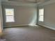 Large bedroom with plush carpet, recessed lighting, and two windows offering scenic outdoor views at 5311 Tuscany Dr # 98 Plapprox Sqft, Douglasville, GA 30135