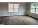 Dining room featuring hardwood floors, elegant wainscoting, and ample natural light at 5311 Tuscany Dr # 98 Plapprox Sqft, Douglasville, GA 30135