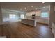 A modern kitchen features white cabinets, stainless steel appliances, and a granite island at 5311 Tuscany Dr # 98 Plapprox Sqft, Douglasville, GA 30135