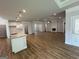 Open concept with a view of the kitchen, living, and dining spaces with modern lighting at 5311 Tuscany Dr # 98 Plapprox Sqft, Douglasville, GA 30135