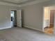 Expansive main bedroom features plush carpet and an ensuite bath, accessed through a bright white door at 5311 Tuscany Dr # 98 Plapprox Sqft, Douglasville, GA 30135