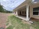 Covered porch with white support columns and backyard lawn area, perfect for gatherings at 5311 Tuscany Dr # 98 Plapprox Sqft, Douglasville, GA 30135