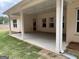 Covered outdoor patio area for entertainment and relaxation with backyard lawn at 5311 Tuscany Dr # 98 Plapprox Sqft, Douglasville, GA 30135