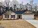 Charming one-story home with brick, red shutters, and a two-car garage at 5311 Tuscany Dr # 98 Plapprox Sqft, Douglasville, GA 30135
