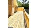 Spacious wooden deck with a brick wall at 2555 Rockbridge Nw Rd, Conyers, GA 30012