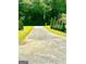Long concrete driveway leading to the home at 2555 Rockbridge Nw Rd, Conyers, GA 30012