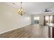 Spacious living room featuring hardwood floors, lots of light, and a modern ceiling fan at 3815 Pleasant Oaks Dr, Lawrenceville, GA 30044